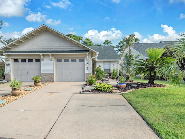 view of front of house featuring a garage and a front lawn