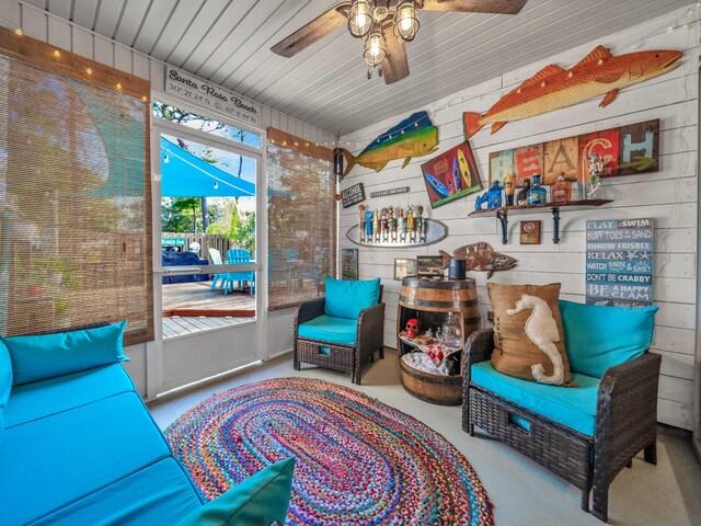 sitting room featuring ceiling fan