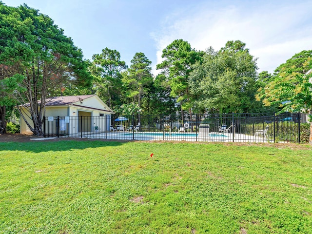 view of yard with a community pool