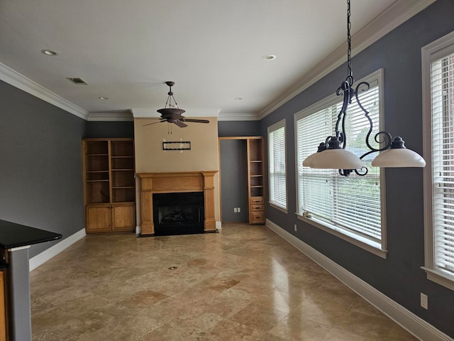 unfurnished living room featuring crown molding and ceiling fan