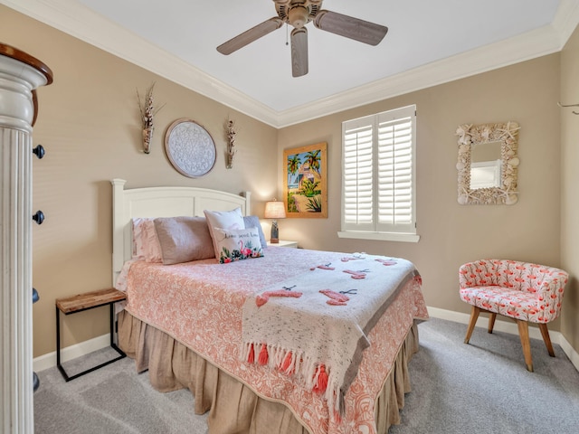 carpeted bedroom with baseboards, ornamental molding, and a ceiling fan