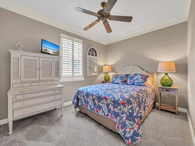 bedroom featuring carpet floors, ceiling fan, baseboards, and crown molding