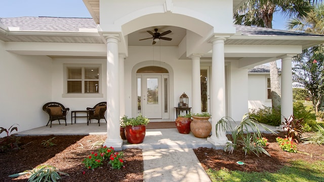 view of exterior entry with ceiling fan