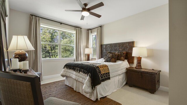 carpeted bedroom with ceiling fan