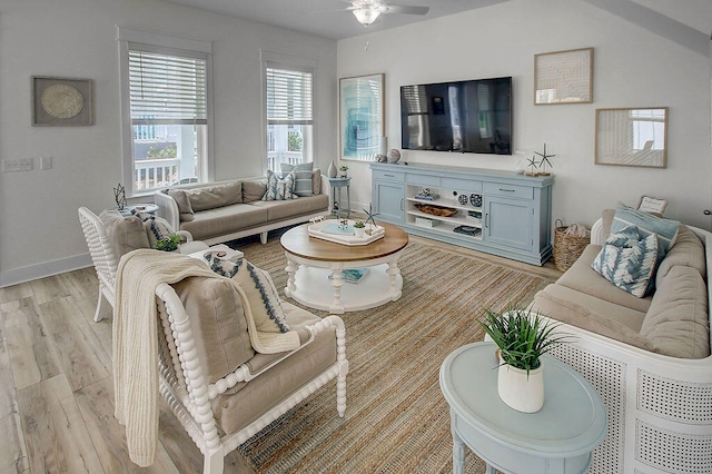 living room featuring ceiling fan and light wood-type flooring