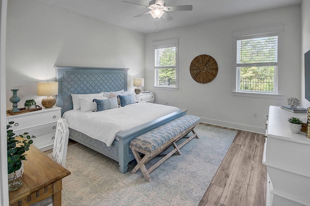 bedroom featuring ceiling fan and light wood-type flooring