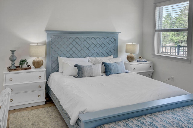 bedroom with light hardwood / wood-style floors