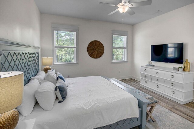 bedroom featuring ceiling fan and hardwood / wood-style flooring