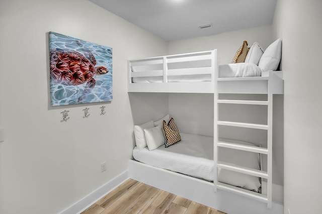 bedroom with light hardwood / wood-style flooring