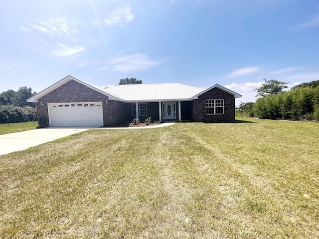 ranch-style house featuring a garage and a front lawn