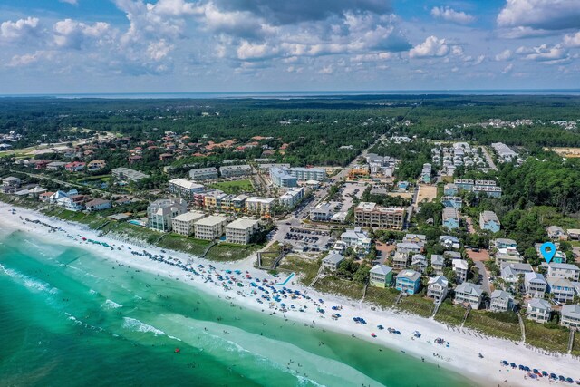 drone / aerial view featuring a water view and a view of the beach