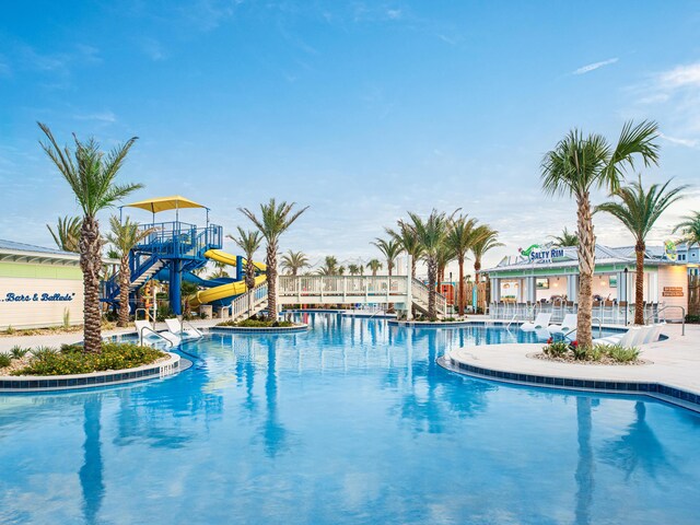 view of pool with a water slide