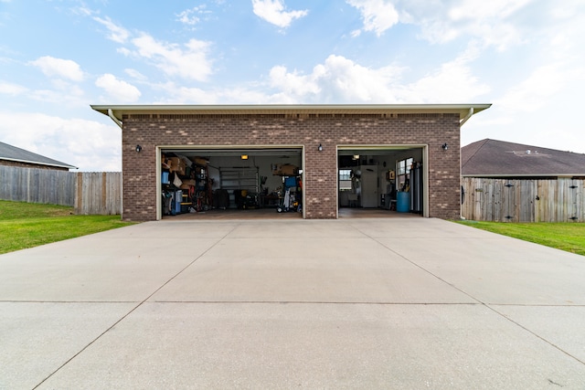 garage featuring a lawn