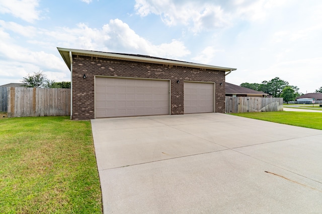 view of front facade with a front lawn and a garage