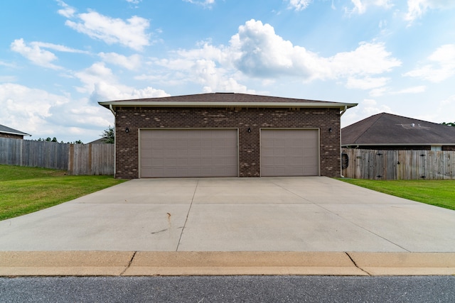 garage featuring a lawn