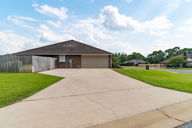 view of front of house with a front lawn and a garage