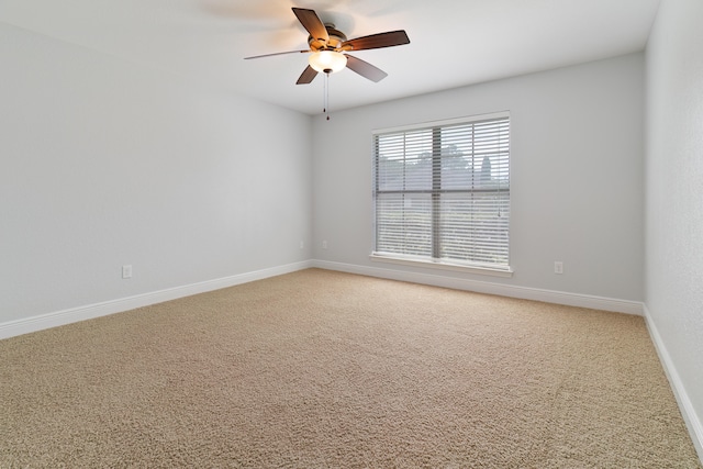 unfurnished room featuring carpet flooring and ceiling fan