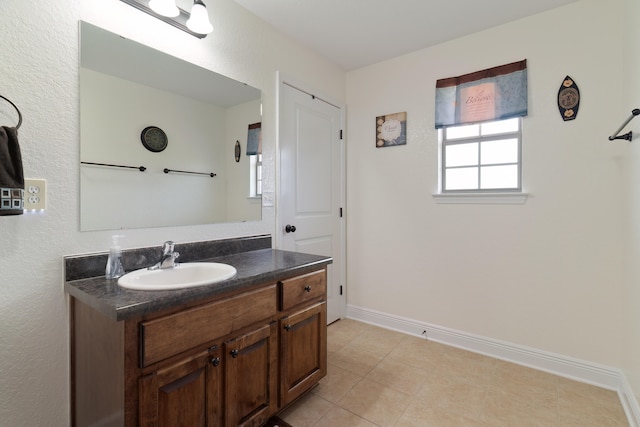 bathroom with tile patterned flooring and vanity