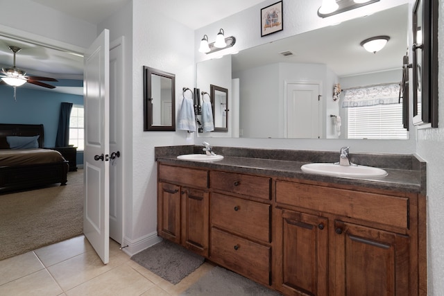 bathroom featuring tile patterned flooring, ceiling fan, and dual vanity