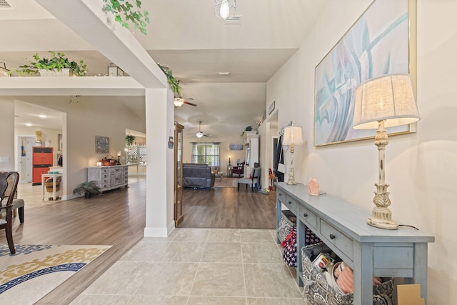 hallway with light hardwood / wood-style flooring