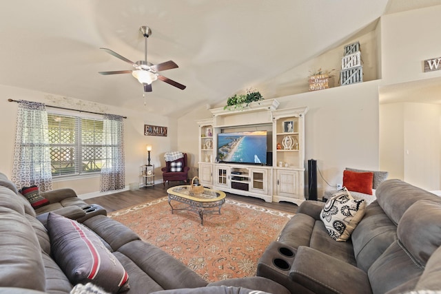 living room featuring hardwood / wood-style flooring, high vaulted ceiling, and ceiling fan