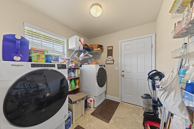 laundry room featuring light tile patterned floors and washer and dryer