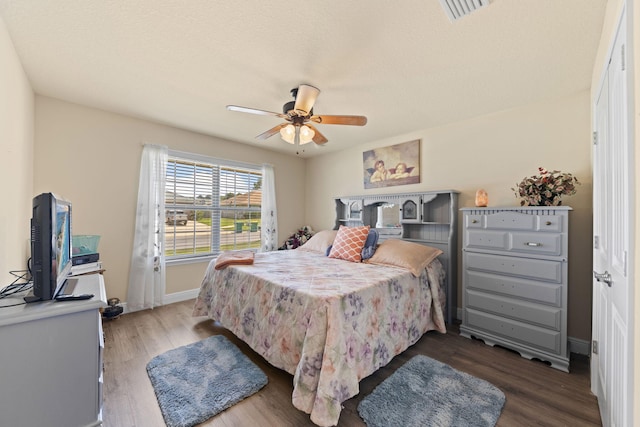 bedroom featuring ceiling fan and wood-type flooring