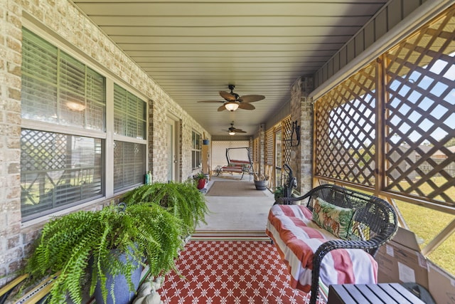 sunroom / solarium with ceiling fan