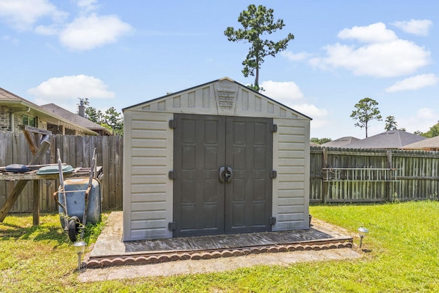 view of outdoor structure with a lawn