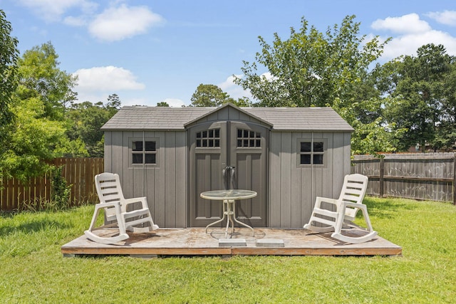 view of outbuilding with a yard