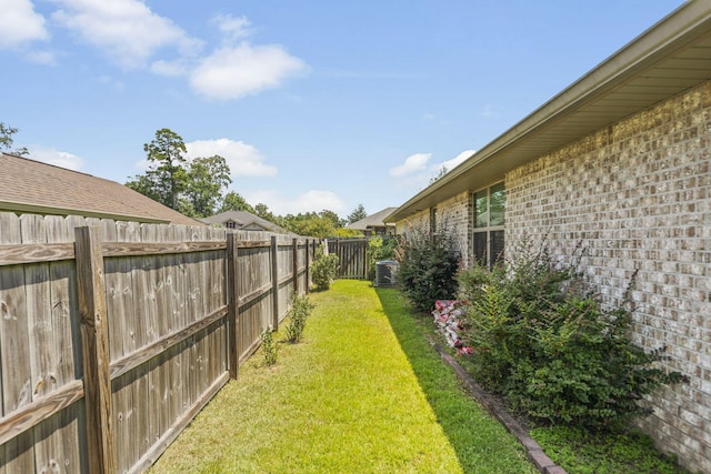 view of yard with central AC