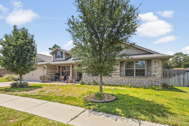 view of front of home with a front yard and a garage