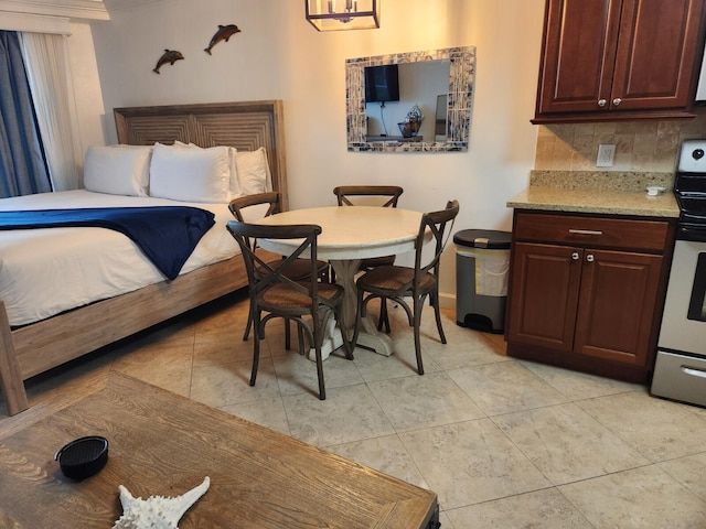 bedroom with light tile patterned floors