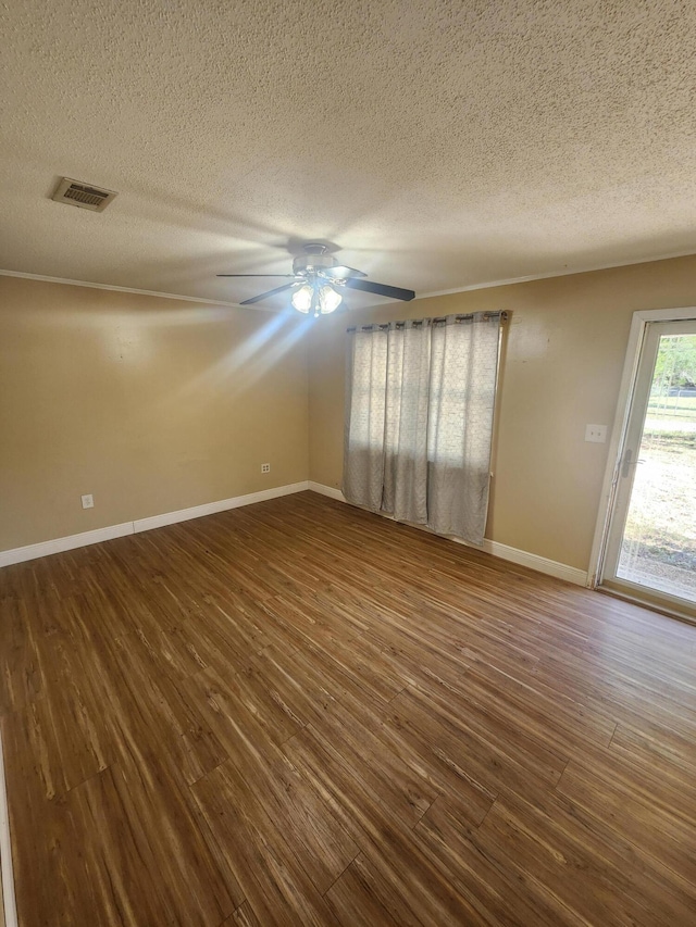 spare room with a textured ceiling, hardwood / wood-style flooring, and ceiling fan