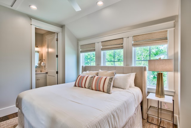 bedroom with ensuite bathroom and wood-type flooring