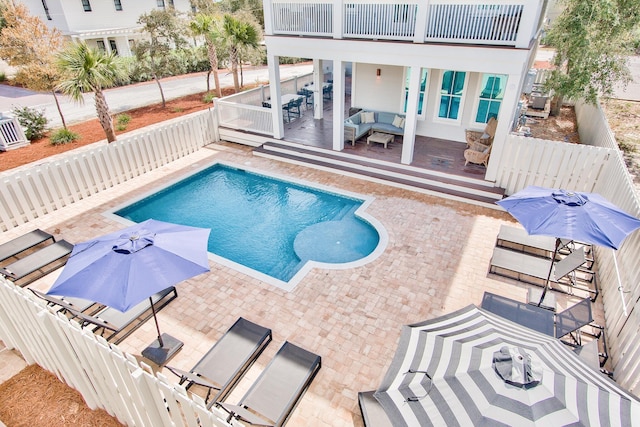 view of swimming pool with a patio