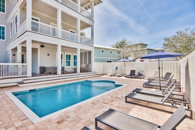 view of swimming pool featuring a patio area