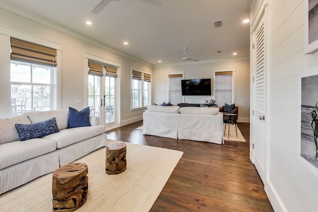 living room featuring ceiling fan, dark wood-type flooring, crown molding, and french doors