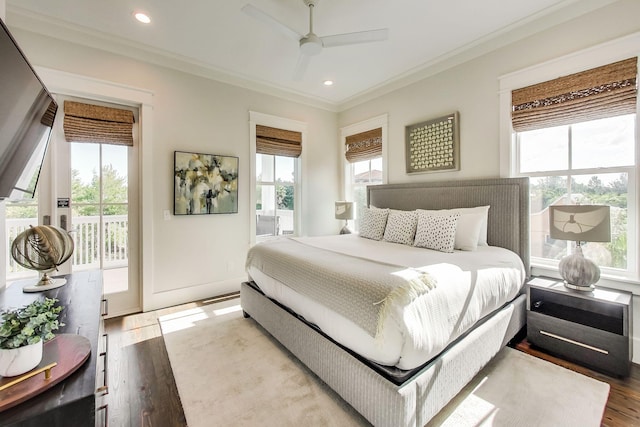 bedroom with hardwood / wood-style flooring, access to outside, crown molding, and multiple windows