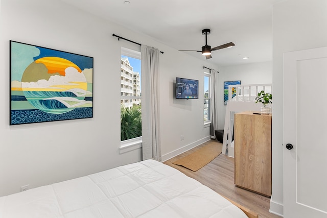 bedroom featuring ceiling fan and hardwood / wood-style floors