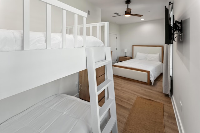 bedroom with hardwood / wood-style flooring and ceiling fan