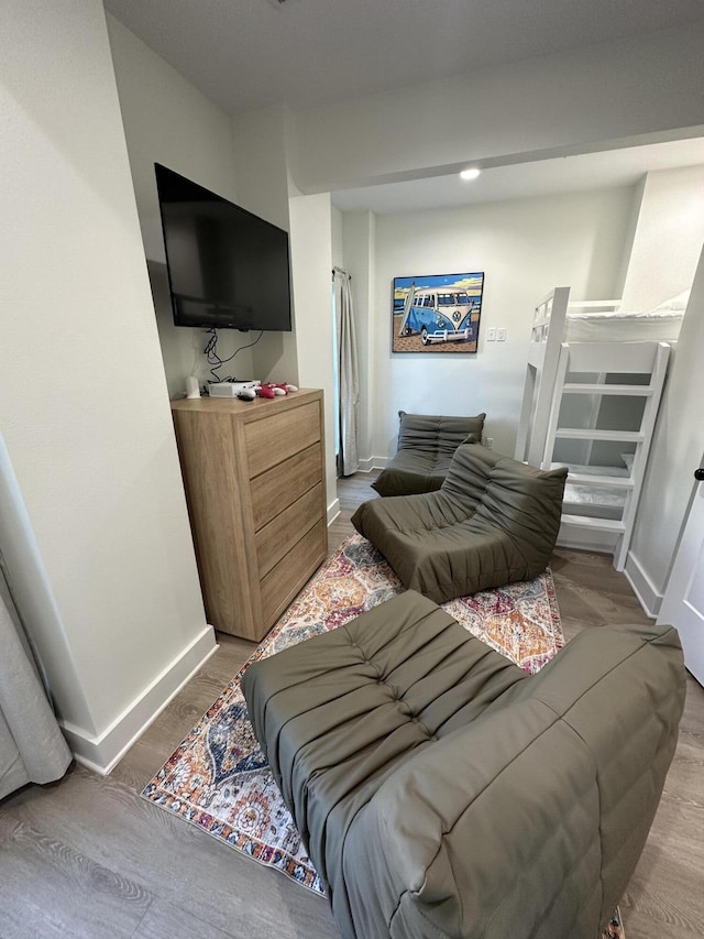 bedroom with wood-type flooring