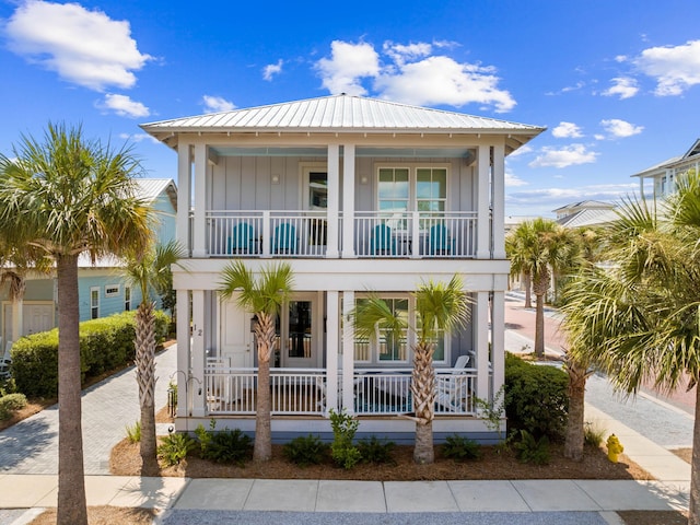 view of front of home featuring a balcony and a porch