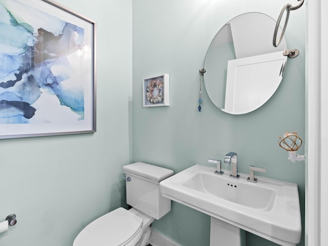 bathroom featuring sink and toilet