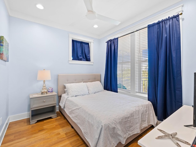 bedroom featuring light wood-type flooring and ceiling fan