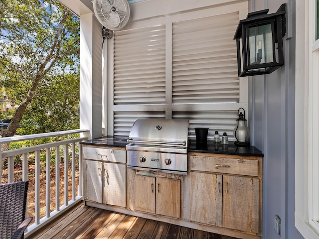 wooden deck featuring area for grilling and exterior kitchen