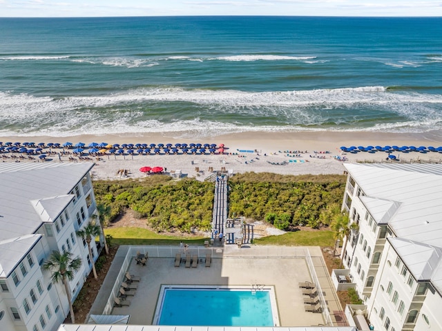 aerial view featuring a water view and a beach view