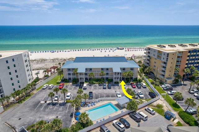 aerial view featuring a water view and a beach view