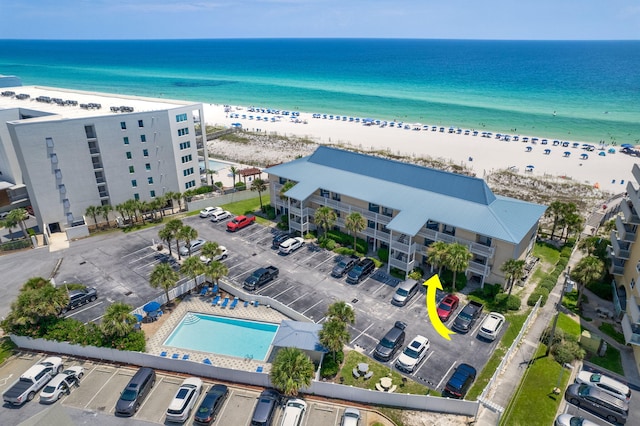 aerial view featuring a view of the beach and a water view