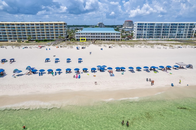 aerial view with a water view and a view of the beach